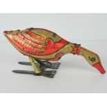 A vintage c1920's 'The Golden Goose That Lays the Golden Eggs' tinplate wind-up clockwork toy by