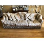 A very large three seater Knoll type sofa having shaped back and sides,