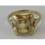 A 9ct gold and citrine ring, emerald cut citrine of pale yellow hue approx 2ct,