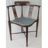 An Edwardian mahogany framed corner chair strung with boxwood and ebony,