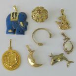 Five 9ct gold pendants including merman, dolphin, scrollwork pendant set with oval opal cabachon,