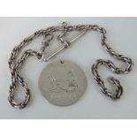 A HM Scottish silver fob having engraved scene upon, 1965 Edinburgh hallmark, 3.2cm dia.