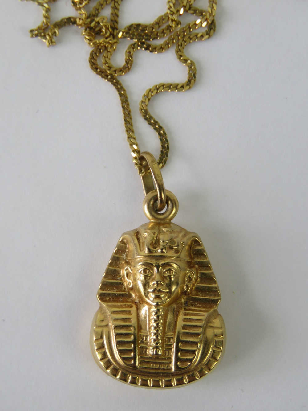 A 9ct gold pendant in the form of a Pharaoh's mask hallmarked 375,