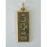 A 9ct gold ingot pendant hallmarked Birmingham 2000, 4cm in length, 10.8g.