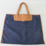 A Hackett London tote bag in tan leather and navy blue canvas.