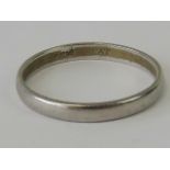 A platinum ring, size P, unengraved band stamped Plat, 3g.