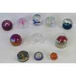 Ten glass paperweights including three with marks for Caithness (seconds) and a millefiori example.