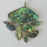 A large silver and abalone shell pendant comprising seven articulated panels, stamped 925,