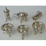 A six piece HM silver cruet set comprising three salts, a pair of pepperettes (one leg a/f),