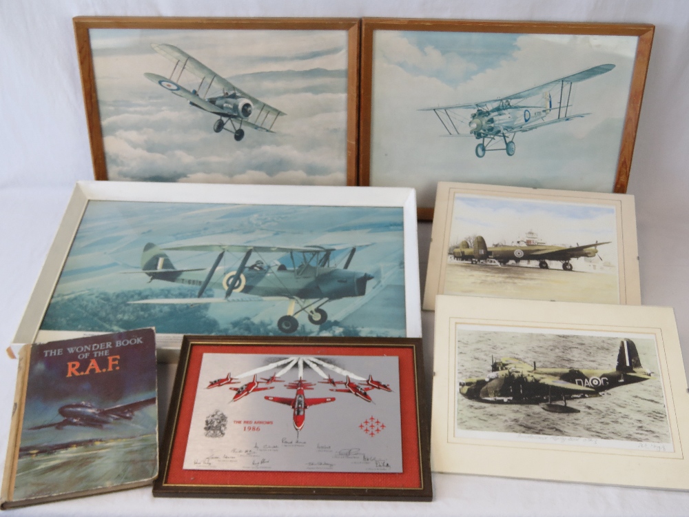 A quantity of RAF related items including; photographs, prints, the wonderbook of the RAF,