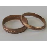 Two 9ct rose gold stackable rings, both size T and hallmarked 375, one with engraved floral pattern.