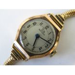 A 9ct gold ladies Record wristwatch having heavy 9ct gold snake link strap, Birmingham 375 hallmark,