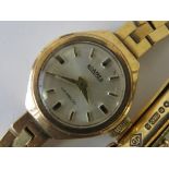 A 9ct gold vintage ladies Roamer wristwatch having integral 9ct gold strap,