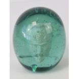 A rare 19thC green glass dump weight incorporating a clay pipe bowl in the form of a Prussian