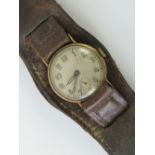 A 9ct gold wristwatch on brown leather military style strap, 15 jewel Swiss movement,