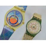 Two vintage Swatch watches; one having 24hr dial marked Swatch AG 1993 with star signs pattern,