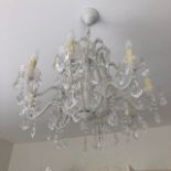 A eight arm Venetian style crystal glass chandelier complete with glass drops, 101cm to ceiling.