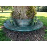 A large and impressive metal circular tree bench formed from two semi-circles,