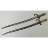 A good pair of late 19th century French sword bayonets each having beehive grip,