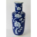 A Chinese blue and white rouleau vase with hand painted prunus decoration,