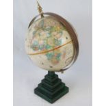 A Replogle terrestrial globe, on a faux malachite stepped base, 43cm high.