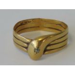 A yellow gold serpent ring having rubbed Chester hallmark (18ct?),