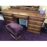 A fine quality contemporary 'Royal Oak' kneehole dressing chest having central frieze drawer