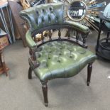 A contemporary green leather button back office desk elbow chair.