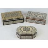 Three Egyptian mosaic jewelry boxes, each inlaid with mother of pearl and lined with velvet.