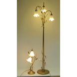 A contemporary freestanding lamp standard having three branches and complete with foliate
