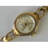 A vintage 9ct gold Accurist ladies 21 jewel watch complete with integral 9ct gold strap,