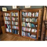 A good matched pair of oak open bookcases each having five shelves within, reeded columns,