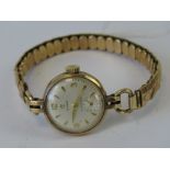 A vintage 9ct gold Cyma ladies wristwatch on expanding gold plated Excalibur expanding bracelet,