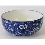 A blue and white fruit bowl by Mintons.