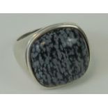 A silver ring having large grey and black agate square cabachon upon, approx 2.1cm wide, size T-U.