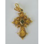 An 18ct gold filigree cross, 3.5cm in length, stamped 18ct, 2.5g.