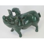 A contemporary painted cast iron 'flying pig' money box, 32cm in length.