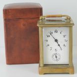 A five glass brass cased carriage clock having white enamel dial and subsidiary dial,