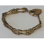 A 9ct rose gold bracelet having double x-shaped panels and heart padlock clasp, stamped 9ct, 11.9g.