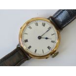 A 15ct gold vintage gents watch having white enamel dial,