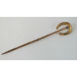 A vintage 9ct gold tie pin with horseshoe terminal, stamped 9ct,