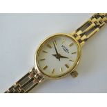 A 9ct gold Rotary ladies wristwatch having integral 9ct gold three bar strap, hallmarked 375,