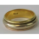 A white and yellow metal ring having single and triple Arabic hallmark, size V-W, 11.9g.