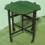 A vintage baise top folding games table on stained oak folding base.