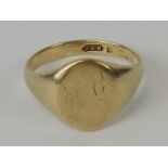 A 9ct gold signet ring having partially erased initials engraved upon, hallmarked 375, size T, 4.