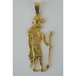 A yellow metal pendant depicting the Egyptian god Horus, having single and double Arabic hallmark,