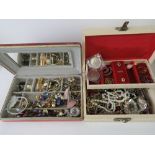 A quantity of assorted costume jewellery contained within two contemporary jewellery boxes.