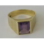 A 14ct gold and amethyst ring, large rectangular cut amethyst in rubover setting, approx 2.