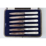 A set of six HM silver and mother of pearl handled fruit knives,