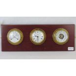 A Sowester brass cased clock, barometer and thermometer/hygrometer set, on wall mounted plaque.